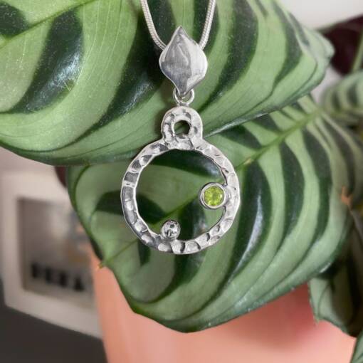 Cosmos Peridot circle pendant, Irish jewellery handcrafted in sterling silver by Caraliza Designs